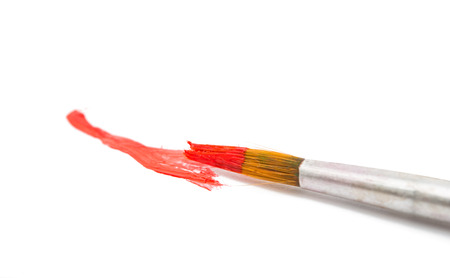 Abstract gouache paint and brush, isolated on whiteの写真素材