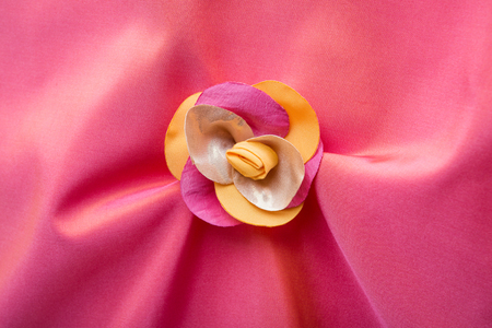 background material with fabric flowerの写真素材