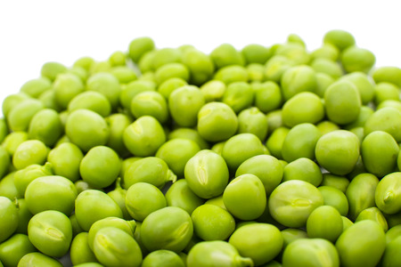 green peas isolated on white backgroundの写真素材