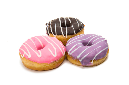 Donuts in glaze isolated on white backgroundの写真素材