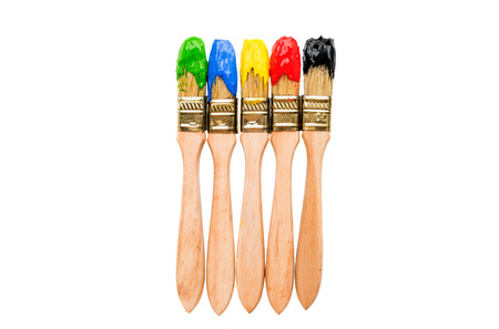 Brush with colored paint isolated on a white background