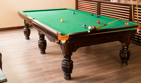 Billiard balls composition on green pool table