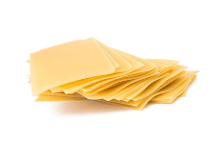Top view of lasagna sheets stack isolated on whiteの写真素材