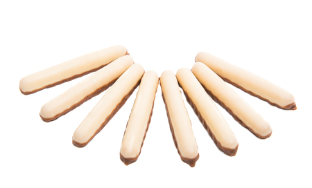 biscuits sticks in glaze isolated on white backgroundの写真素材