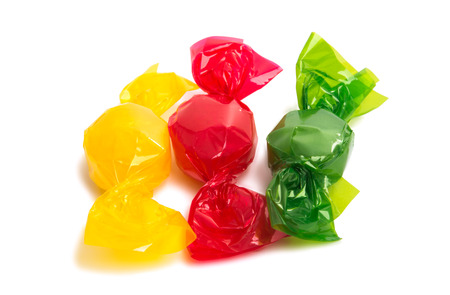candy in wrapper isolated on white backgroundの写真素材