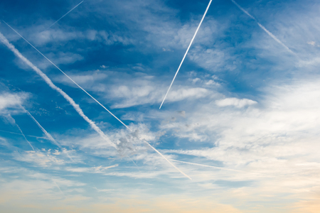 blue sky in the paths from the aircraftの写真素材