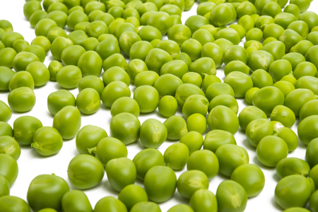 green peas isolated on white backgroundの写真素材