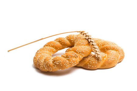 Bagel with sesame seeds isolated on white background