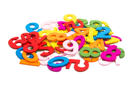colored wooden numbers on a white background