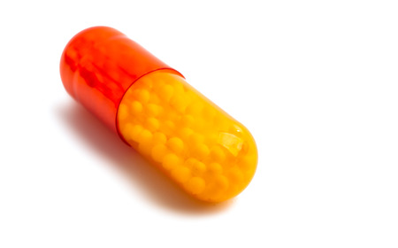 capsule with vitamin C isolated on white background
