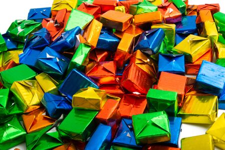 candy in a multi-colored wrapper isolated on white backgroundの写真素材