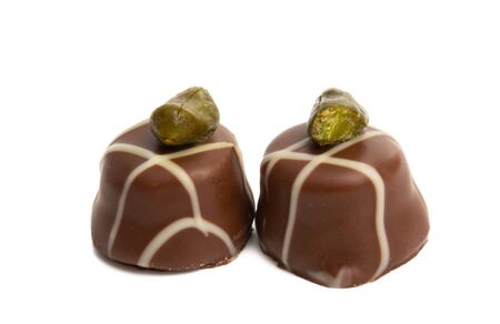 swiss chocolate candies isolated on white backgroundの写真素材