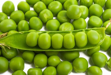 green peas isolated on white backgroundの写真素材