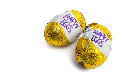 Easter eggs in foil on a white background