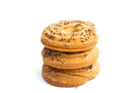 ring cookies with poppy seeds isolated on white backgroundの写真素材