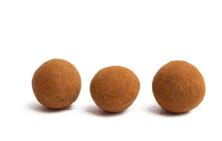 chocolate truffles with nuts isolated on white backgroundの写真素材