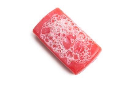soap with foam isolated on white backgroundの写真素材