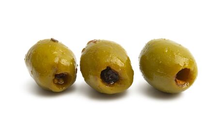 olives isolated on a white backgroundの写真素材