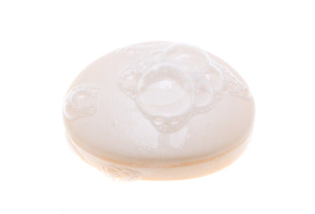 soap with foam isolated on white backgroundの写真素材
