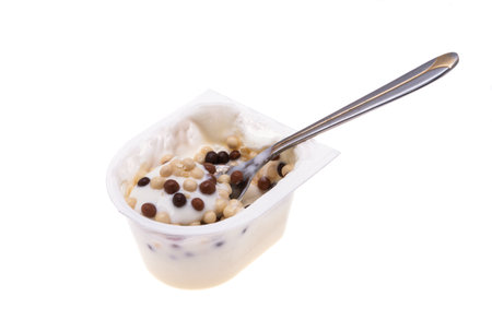 yogurt in a plastic cup isolated on white backgroundの写真素材