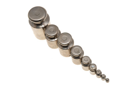 set of metal weights for scales isolated on white backgroundの写真素材