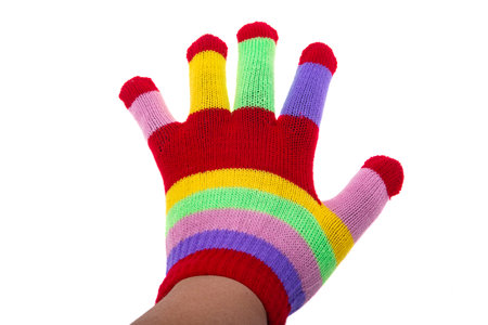 colored knitted glove isolated on white backgroundの写真素材