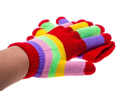 colored knitted glove isolated on white backgroundの写真素材