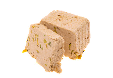 halva with pistachios isolated on white background