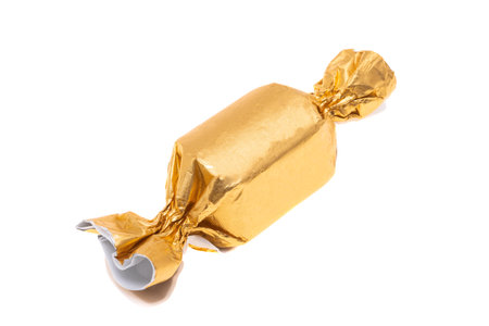 chocolate candy in wrapper isolated on white backgroundの写真素材