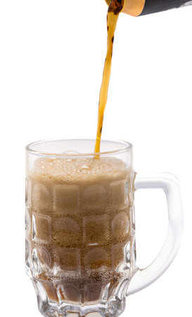 glass of dark beer isolated on white background