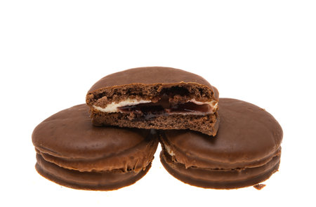 cookies covered with chocolate glaze isolated on white backgroundの写真素材