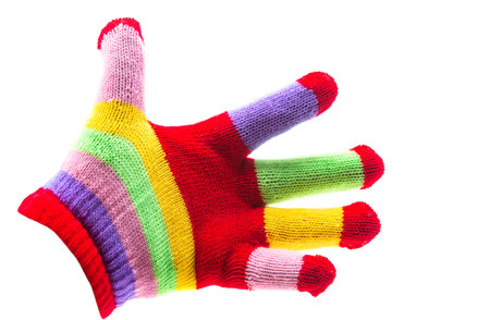 colored knitted glove isolated on white backgroundの写真素材