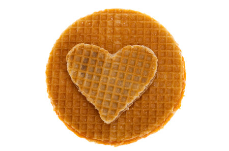 dutch waffle heart isolated on white backgroundの写真素材