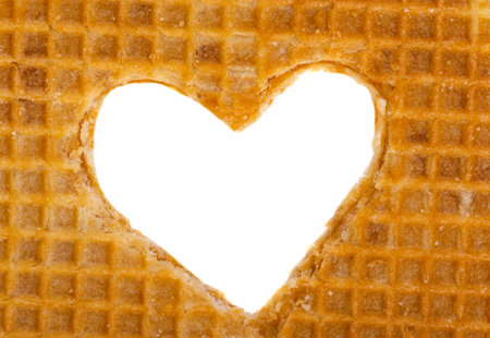 heart from dutch waffles isolated on white backgroundの写真素材