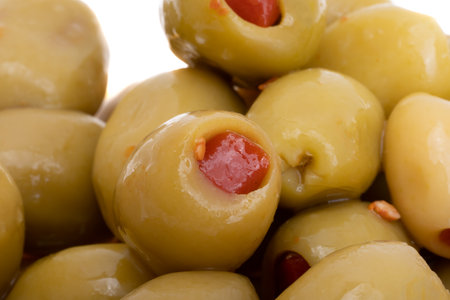 olives stuffed with pepper isolated on white backgroundの写真素材