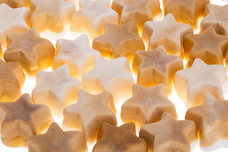 candy christmas stars isolated on white backgroundの写真素材