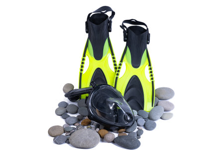 flippers on pebbles isolated on white backgroundの写真素材