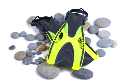 flippers on pebbles isolated on white backgroundの写真素材