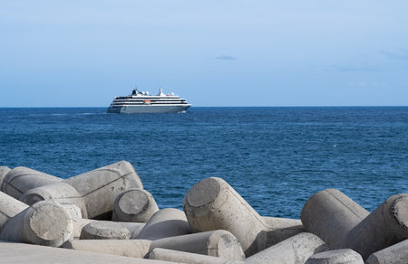 the ship leaves the port of Madeira for the oceanの写真素材
