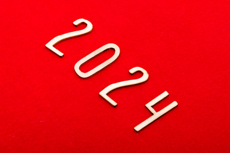 2024 wooden numbers on a red background