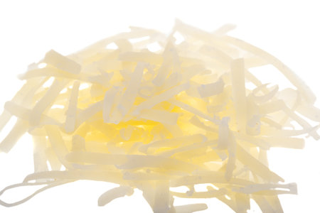 gratified cheese isolated on white backgroundの写真素材