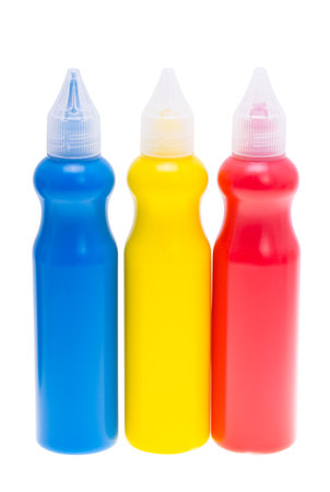 colored paint in a bottle isolated on white backgroundの写真素材