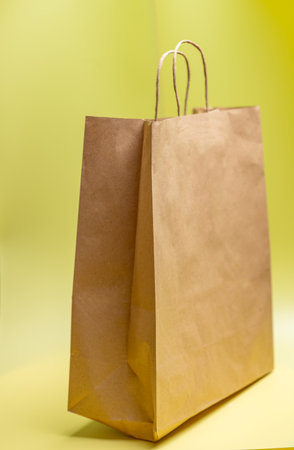 paper bag on yellow backgroundの写真素材