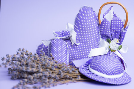 dried lavender in bags on a beautiful lilac backgroundの写真素材