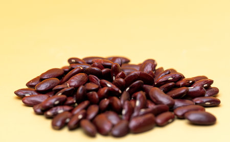 dry beans on yellow backgroundの写真素材