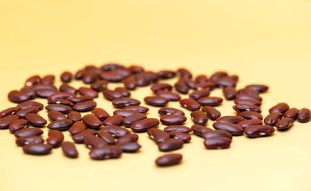 dry beans on yellow backgroundの写真素材