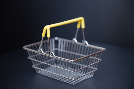 shopping basket on black backgroundの写真素材