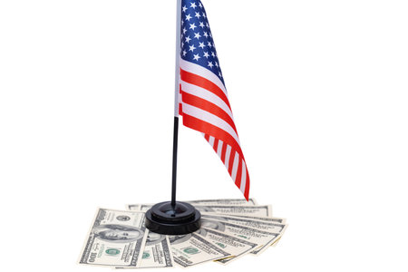 American flag with dollars isolated on white backgroundの写真素材