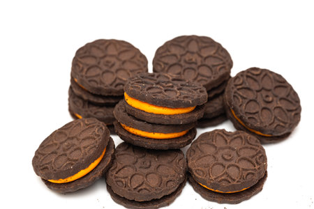chocolate sandwich cookies with orange fillingの写真素材
