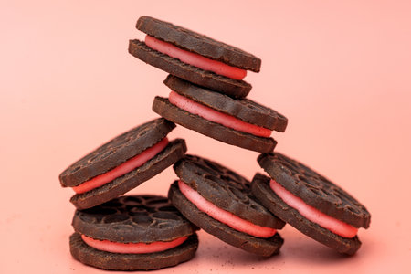 chocolate sandwich cookie with strawberry fillingの写真素材